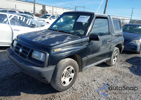 1998 Chevrolet Tracker z USA, uszkodzony, nr VIN 2CNBE1867W6923242